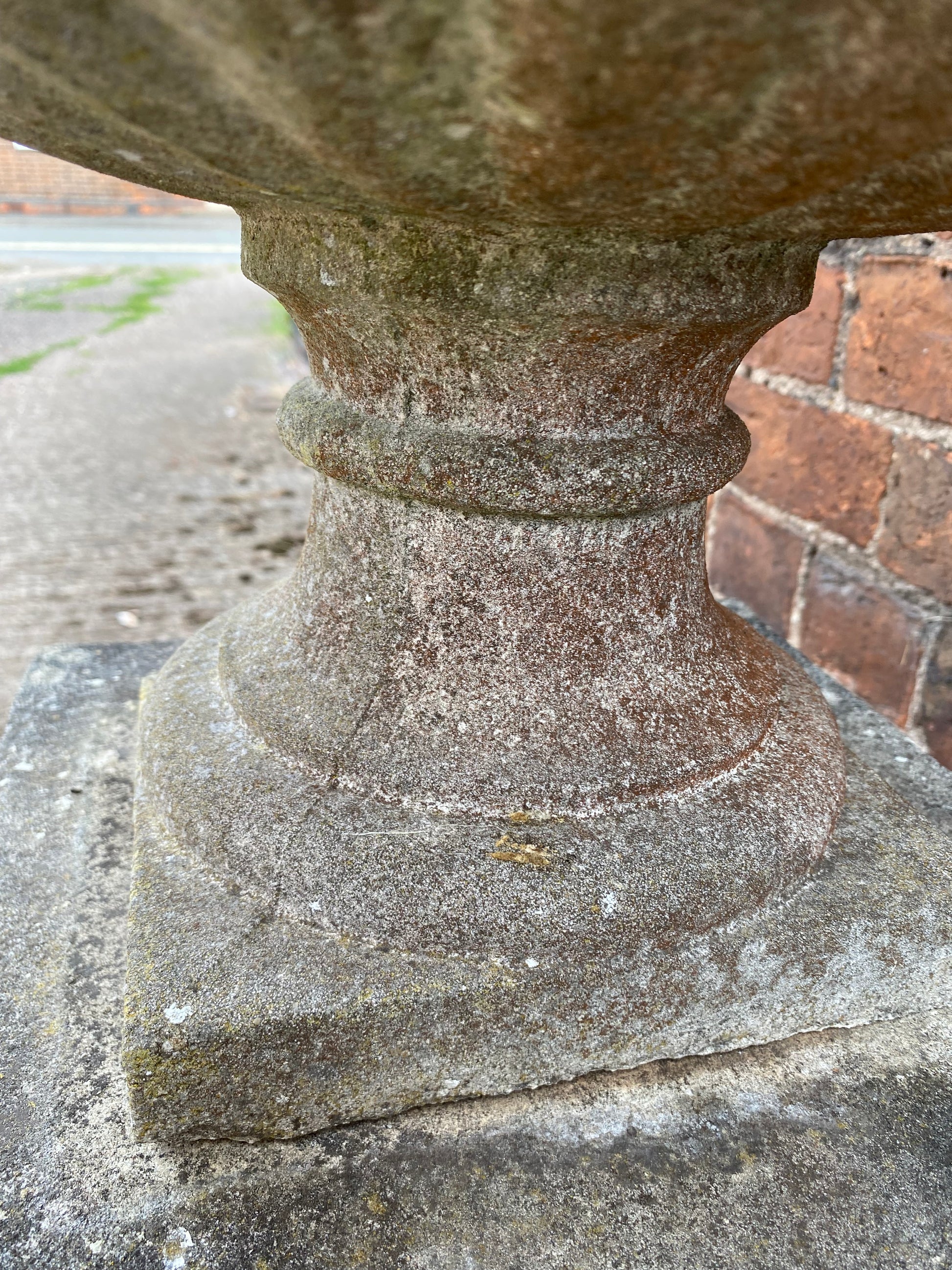 Close-up of base of stone urn